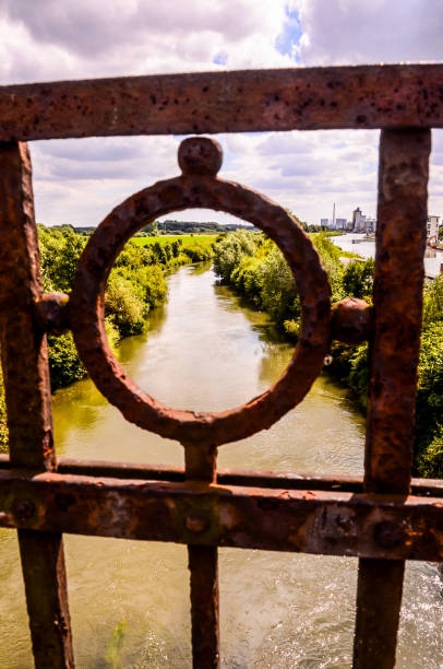 istock A rusted iron gate with a circular hole in the middle 2184933852