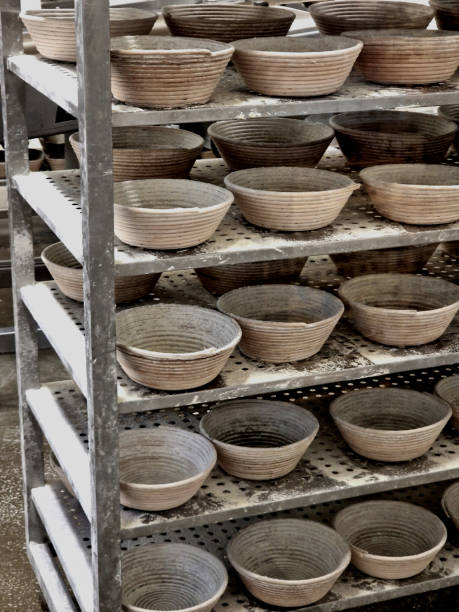 istock baker's racks or straw bowls in which leavened bread is placed. the yeast dough will take the shape of the container on the shelf. trolley in the bakery 2184935908