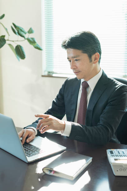 Businessmen in suits working in an office