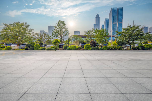 istock Empty parking lot floor and modern city buildings background 2184937284