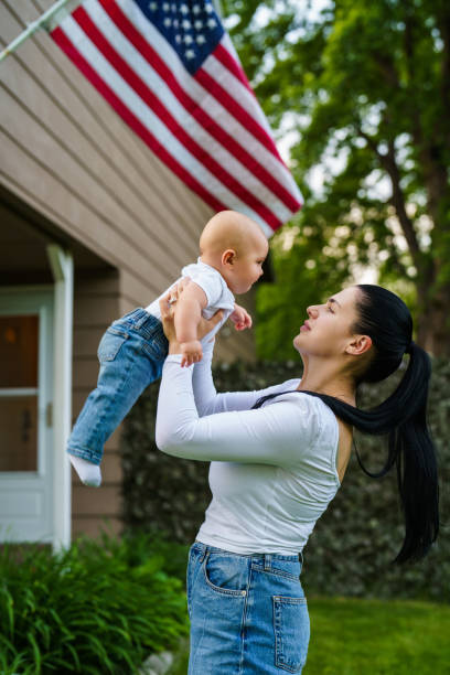 istock Mother and son in front yard playing outdoors 2184939731