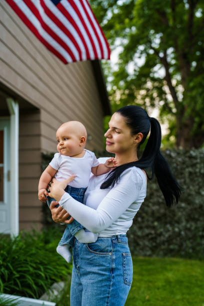 istock Mother and son in front yard playing outdoors 2184940911