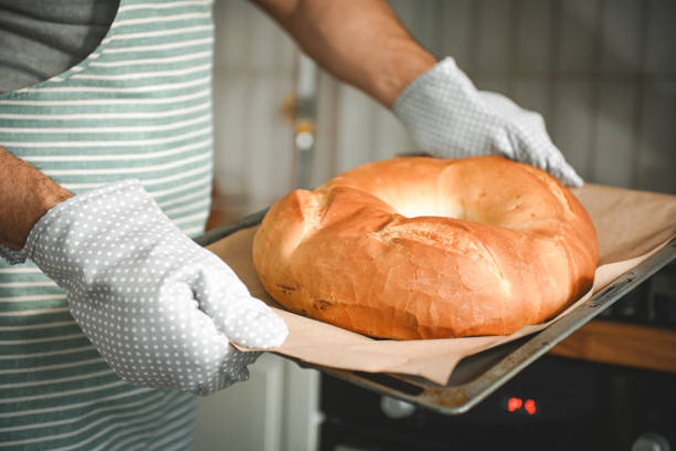 istock man bakes homemade bread 2184948957