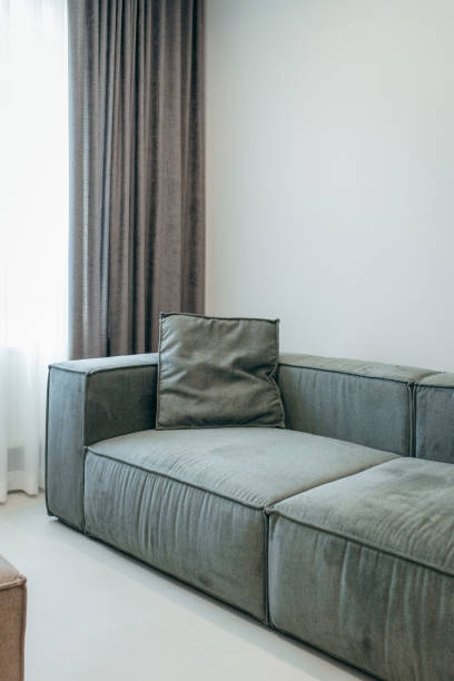 istock Grey pillows on sofa at living room 2184949889