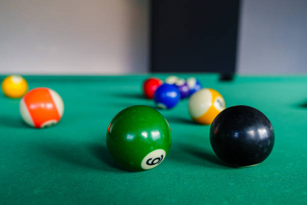istock Focused View of a Pool Table with an Eight Ball 2184950944