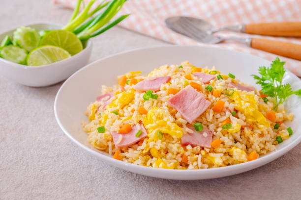 istock Fried rice with ham pork on white plate 2184952781
