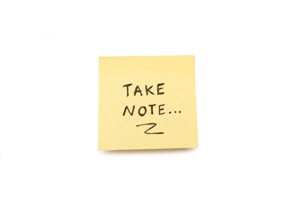 A sticky note on a white background and blue tape