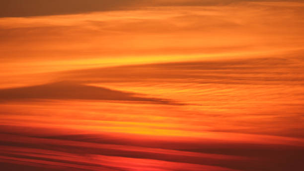 istock Abstract orange and red sunset sky with layered clouds. Nature background for design and print 2184955513