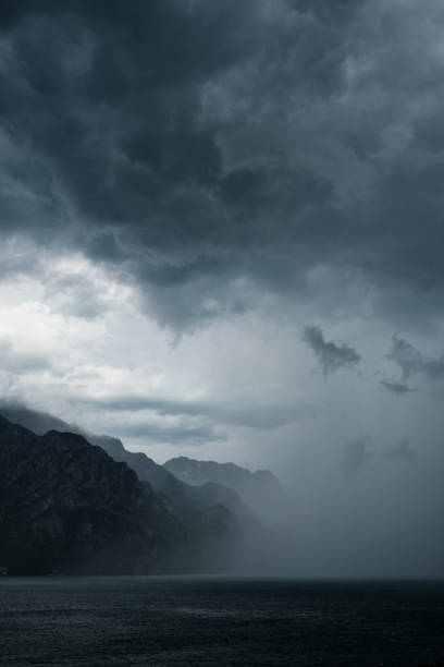 Dramatic Storm Clouds Over Mountainous Coastline and Lake Garda