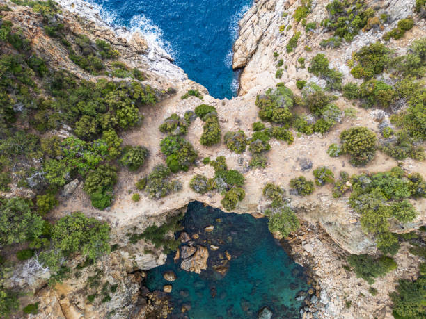 istock Aerial View of Rugged Coastline and Azure Waters 2184963236