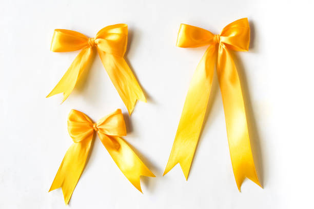 ribbon bows yellow color isolated on white background