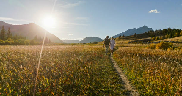 istock Mature couple hike in meadow in autumn 2184971805