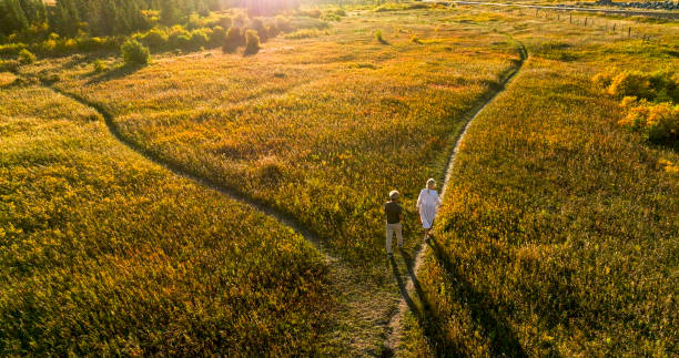 istock Aerial view of mature couple at intersection of pathway 2184972425
