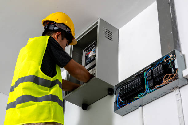 istock Technicians Install photovoltaic solar modules on roof of house. Engineers install or fix solar cells in roof of house. Technician worker on solar panels. Solar panel technician  working on house roof 2184973462