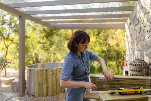 istock Woman working on a DIY project outdoors 2184976509
