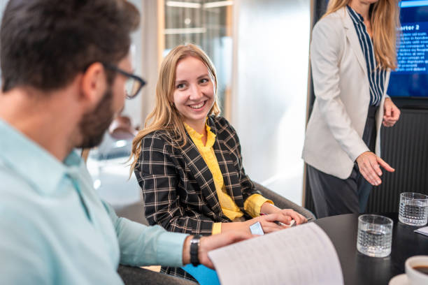 istock Diverse Executives Engage in Strategy Session at Modern Office 2184978230