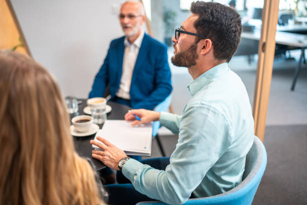 istock Hispanic Businessman Engages in Boardroom Discussion 2184978261