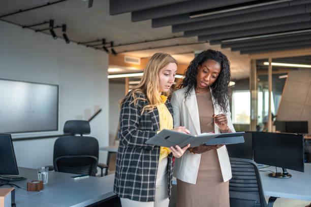 istock Diverse Financial Advisors Engaged in Strategy Session 2184978275