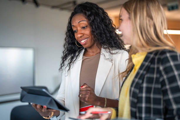 istock Diverse Female Financial Advisors Working with Tablet in Office 2184978315