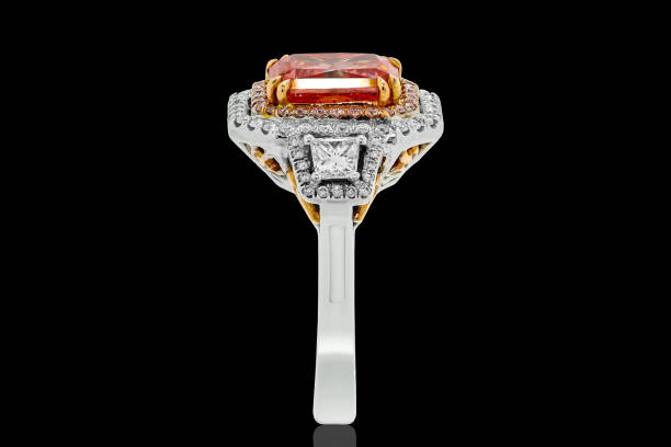 Elegant White and Yellow Gold Ring with Ruby Center Stone and Diamond Accents on Black Background, Luxury Jewelry with Precious Gemstones