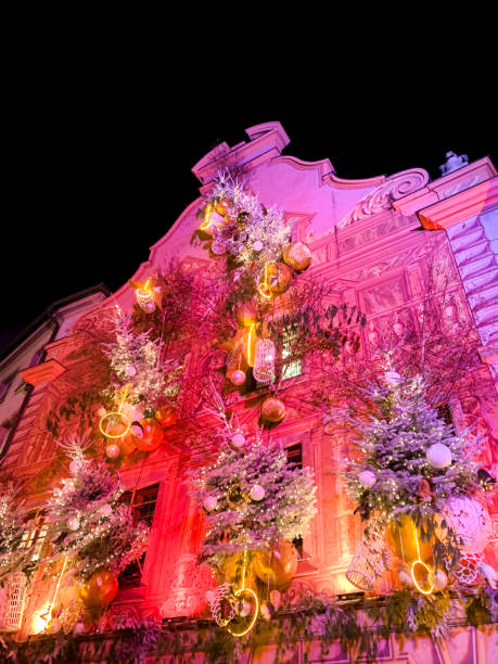 istock Vibrant Christmas Decorated Building Facade with Illuminated Ornaments 2184982817