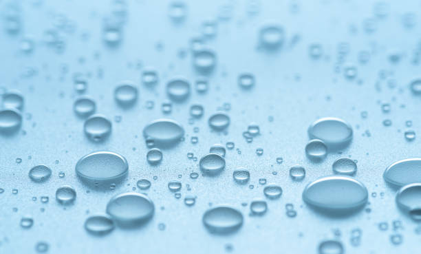 istock Water drops or condensation drops on surface, macro shot. Water drops background as a symbol of freshness and purity. 2184982978