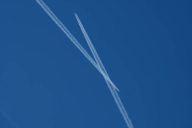istock Airplane trails in the blue sky, contrails. 2184984469