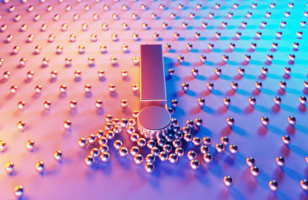 Metallic spheres gravitated towards exclamation point which is illuminated by blue and magenta lights on blue and magenta background. Horizontal composition.