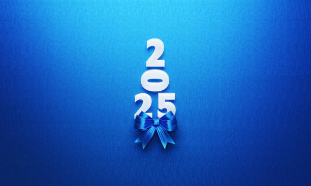 istock 2025 Text Forming A Christmas Tree with Blue Bow Tie on Blue Background 2184987678