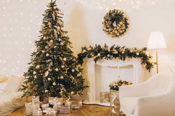 istock Christmas tree with presents illuminating a cozy living room 2184994923