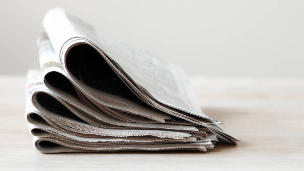 istock Pile of newspapers stacks on table 2184995784