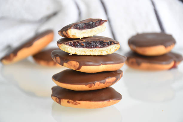 istock jam-filled chocolate cookies stacked on a neutral background 2184997129
