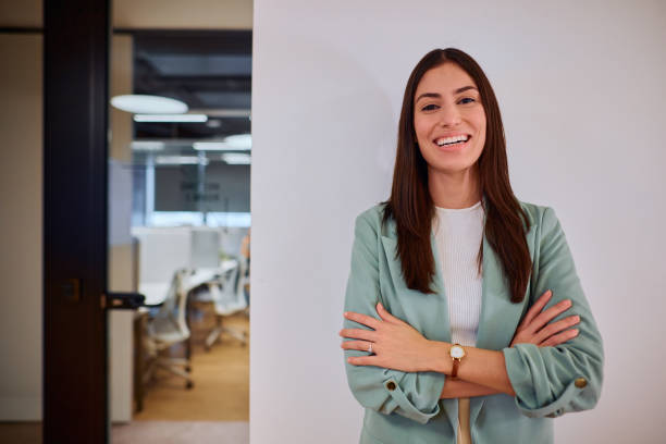 istock Confident Businesswoman Smiling in Modern Office Setting 2184997518