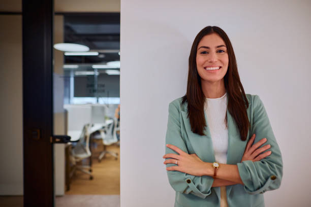 istock Confident Businesswoman Smiling in Modern Office Setting 2184997519