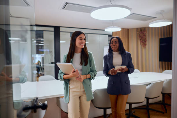 istock Professional Women Exiting Office Meeting Discussion 2184997617