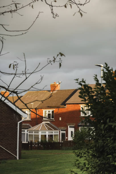 istock England houses in sunset sky background 2185003244