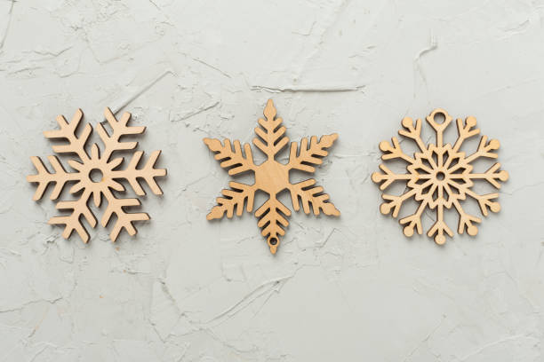 istock Beautiful snowflake on concrete background, top view 2185004305