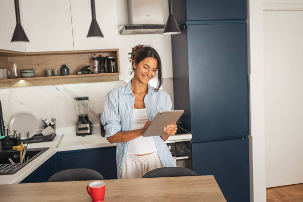 istock Woman using digital tablet to find the breakfast inspiration 2185005036