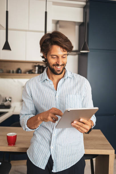 istock Close up portrait of man using digital tablet 2185006068