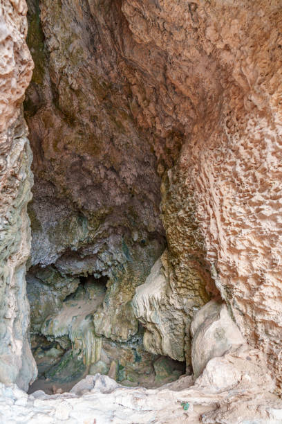 istock View into the dark interior of the cave 2185009596