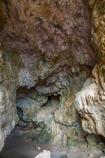 istock View into the dark interior of the cave 2185009597