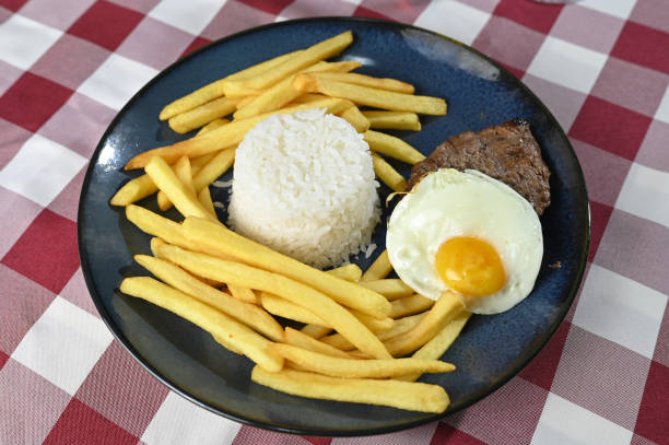 istock rice with fries meat and poached boiled egg lunch meal 2185010111