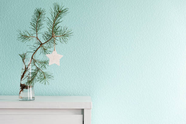 istock Christmas background with a pine branch in a glass vase 2185010146