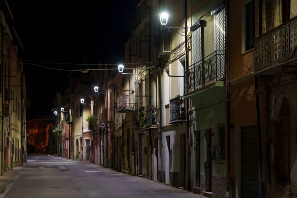 istock A view of an empty street, beautifully lit at night. 2185010389