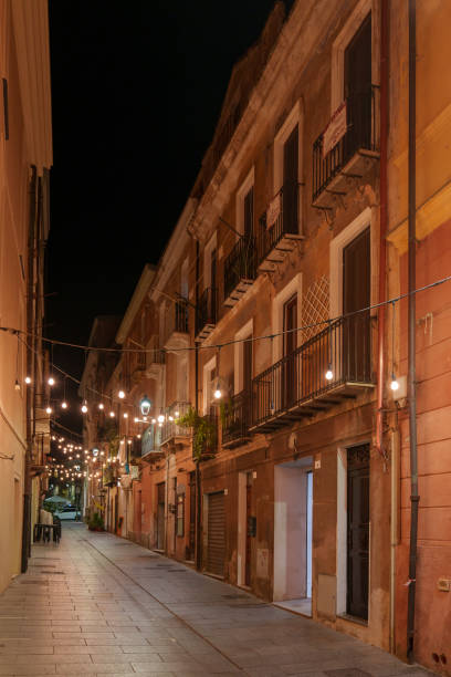 istock A view of an empty street, beautifully lit at night. 2185010473