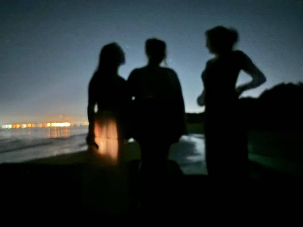 Young friends walking and dancing on party outdoors