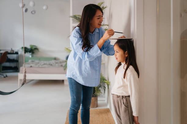 istock Tracking Growth: A Heartwarming Family Moment 2185014891