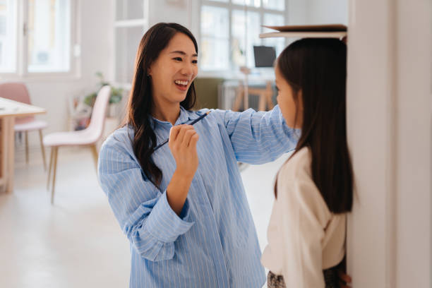 istock Tracking Growth: A Heartwarming Family Moment 2185014901