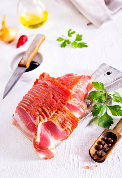 istock smoked bacon slices for hot pot on a table 2185016478