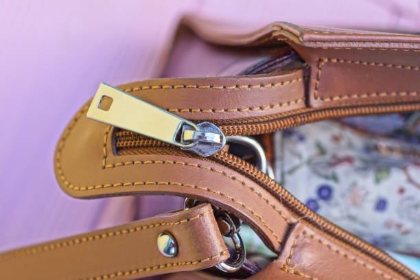 istock open white metal zip on brown leather bag 2185019581